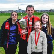 Gareth Jones with his three girls after the game